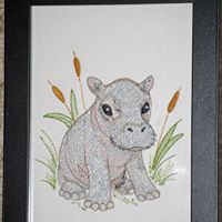 Baby Hippo Embroidery Design on White Denim